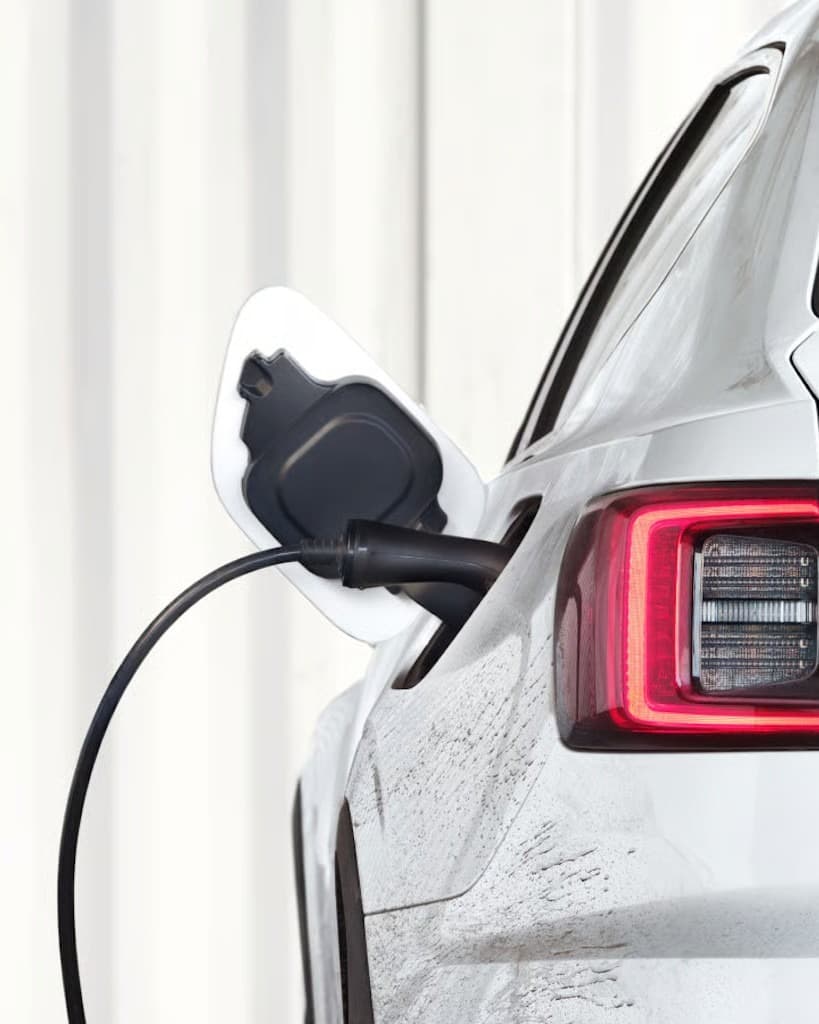 White Polestar 2 electric car charging - clear view
